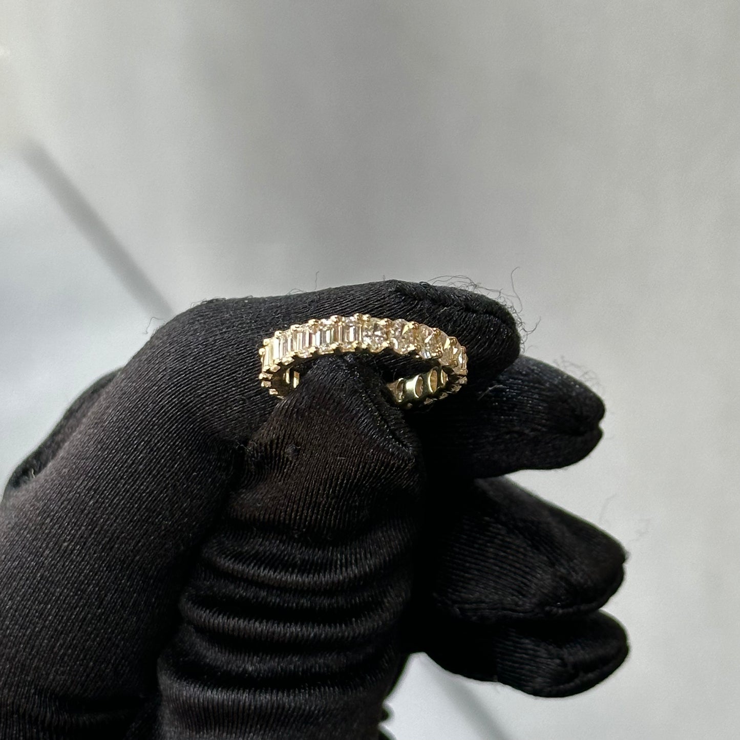Yellow Gold Emerald and Oval Diamond Eternity Band