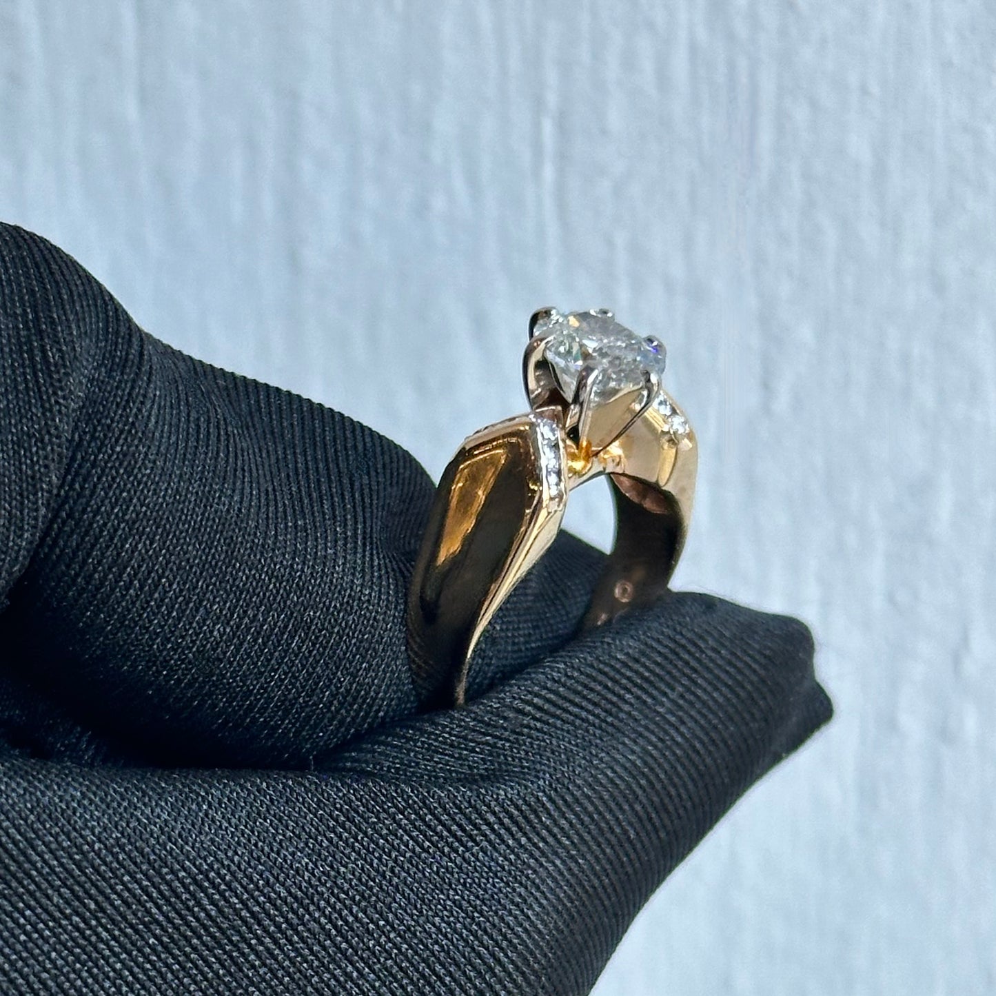 Vintage 0.90ct Oval Diamond Engagement Ring Circa 1980s in 14kt Yellow Gold Channel-Set Diamonds with Concave Knife-Edge Design