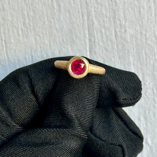 Round Cut Ruby 0.60ct Vivid Red in Color – Handmade 18kt Yellow Gold Bezel Setting with Sandblast Hammered Finish – Designed & Crafted In-House at Facets Fine Jewelry