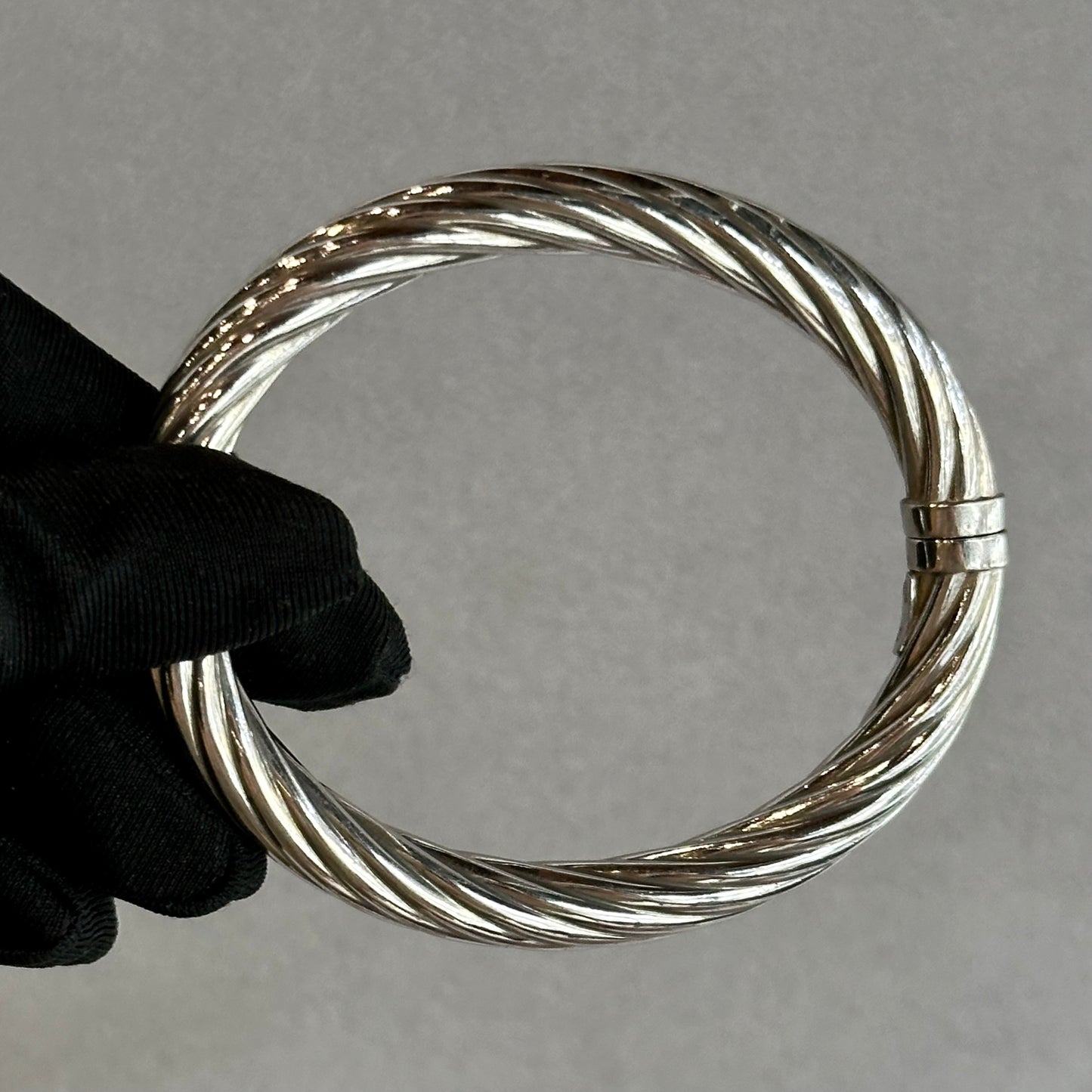 Silver Swirl Bangle with Safety Clasp – Stylish and Secure Jewelry